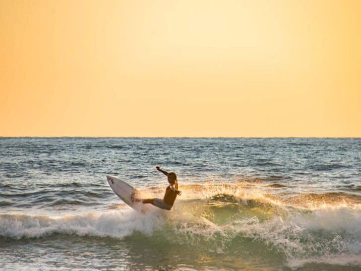 A surfer gets air off a wave in Nosara, Costa Rica