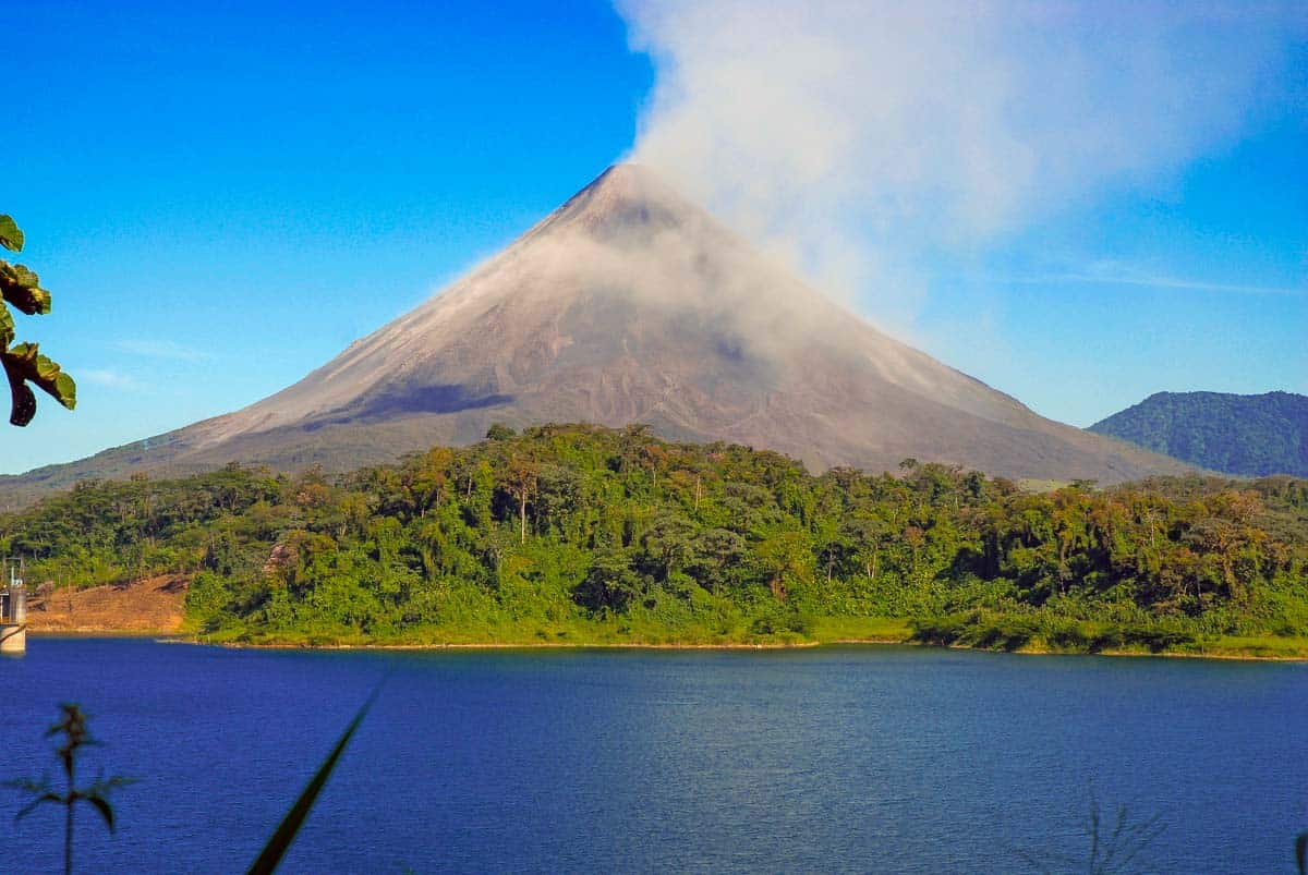 A view of Lake Arenal and Arenal volcano on a clear day near La Fortuna