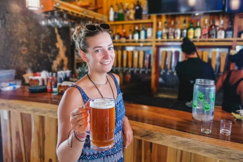 Bailey poses with her huge beer at 2 Gringos Brewing in Samara, Costa Rica