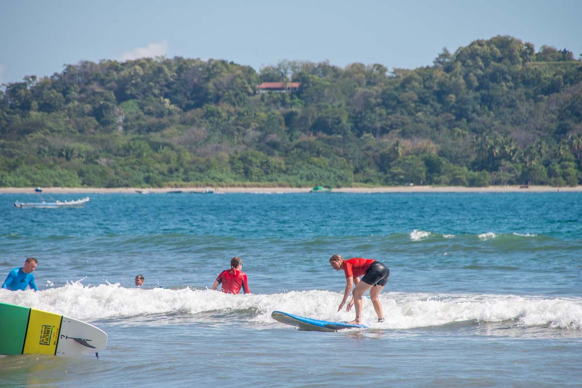 A person learns to surf at samara Beach, Costa Rica
