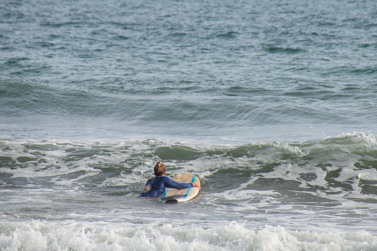 Bailey learning to surf in Tamarindo
