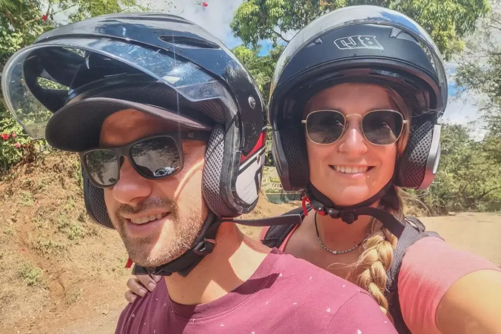 two people take a selfie wearing helmets