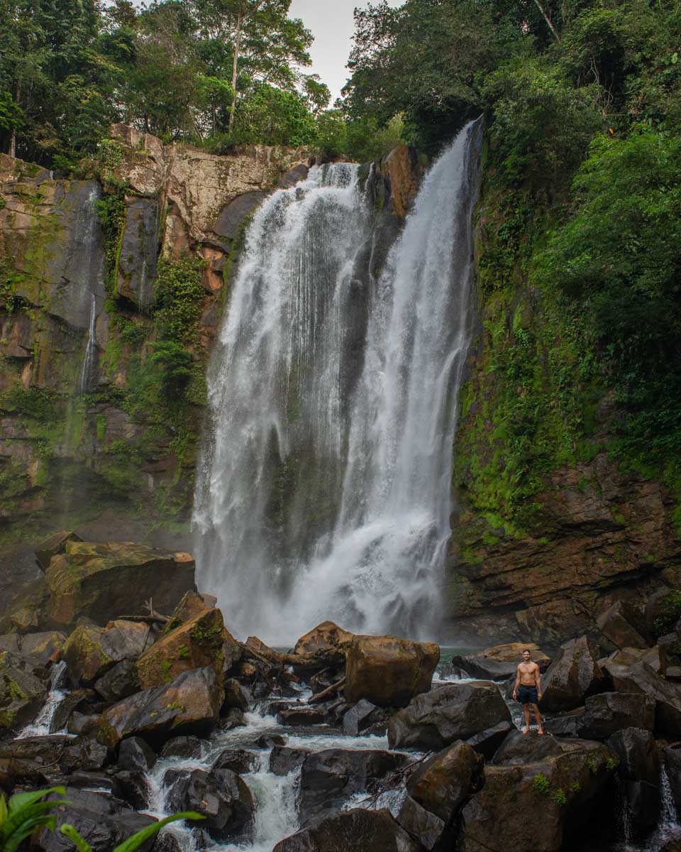 Upper A lady poses for a photo at Nauyaca Waterfalls