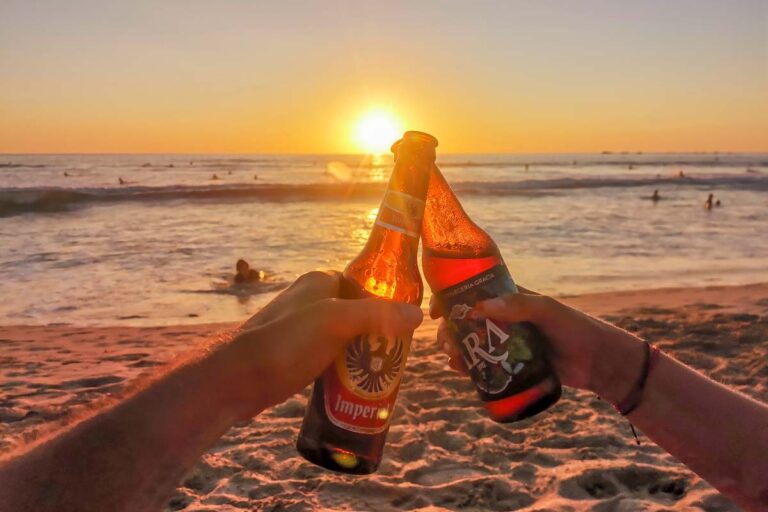 Enjoying beers at Guiones Beach, Nosara as the sun sets
