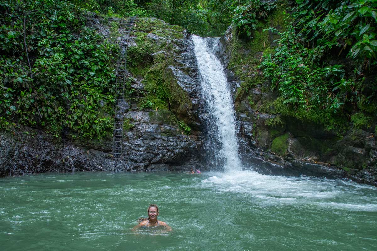 A person swims at Uvita Waterfall, Costa Rica