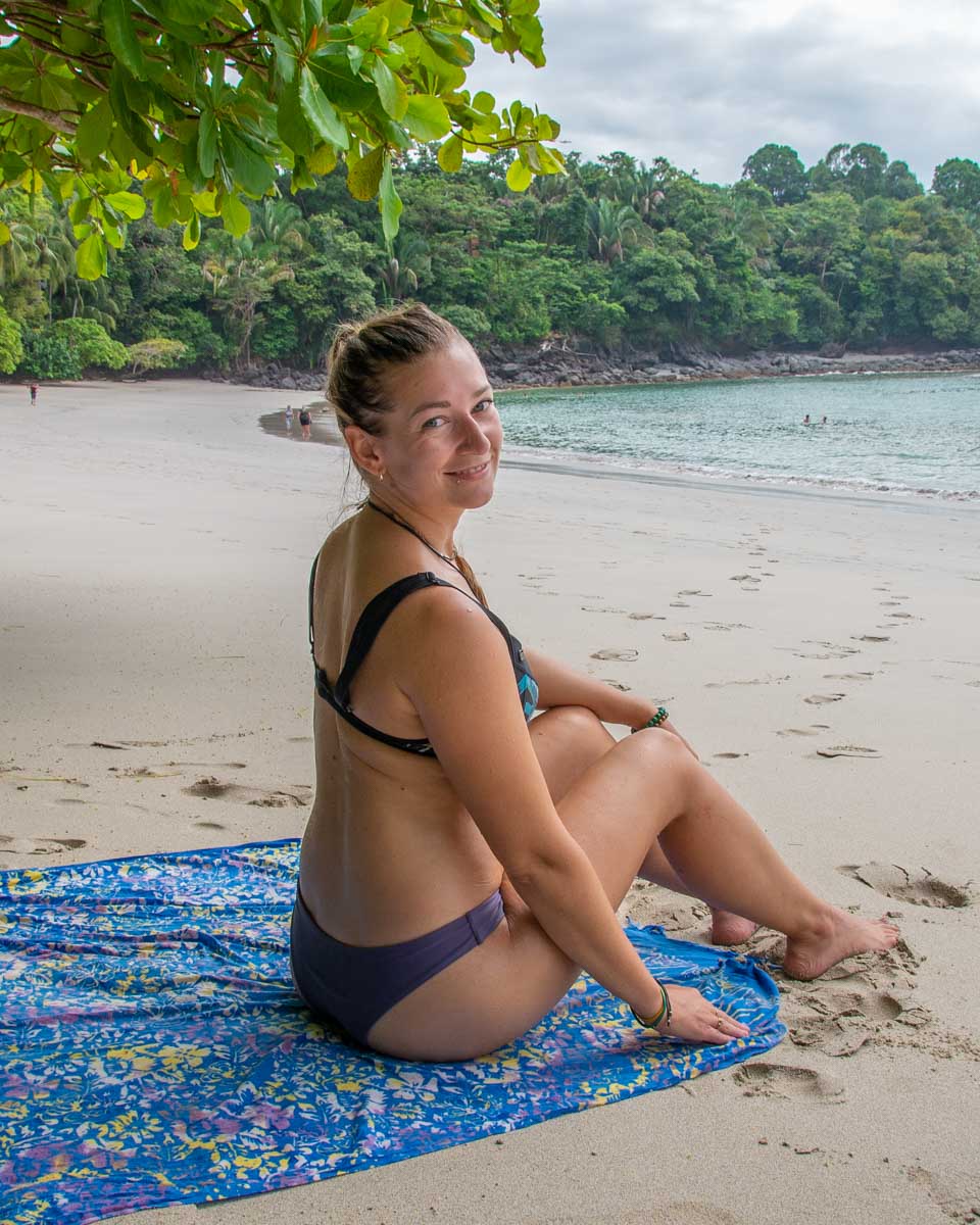 Bailey sits on Manuel Antonio Beach in the national park