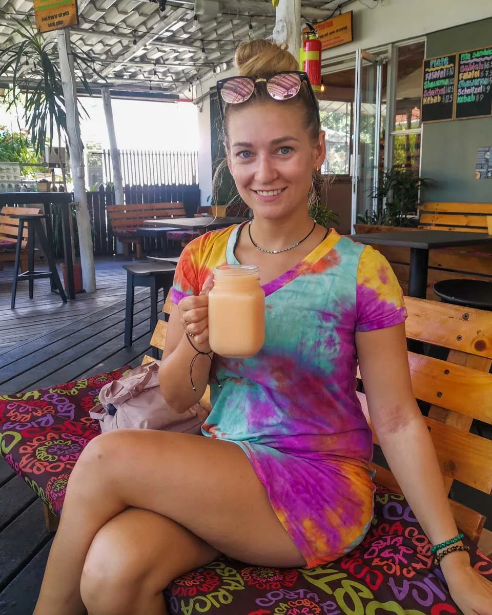 Bailey with a juice at Manuel Antonio Falafel Bar