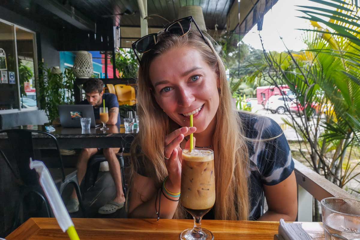 A lady enjoys a coffee at Sibu Café