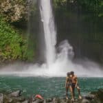 Bailey and Daniel kiss at La Fortuna Waterfall
