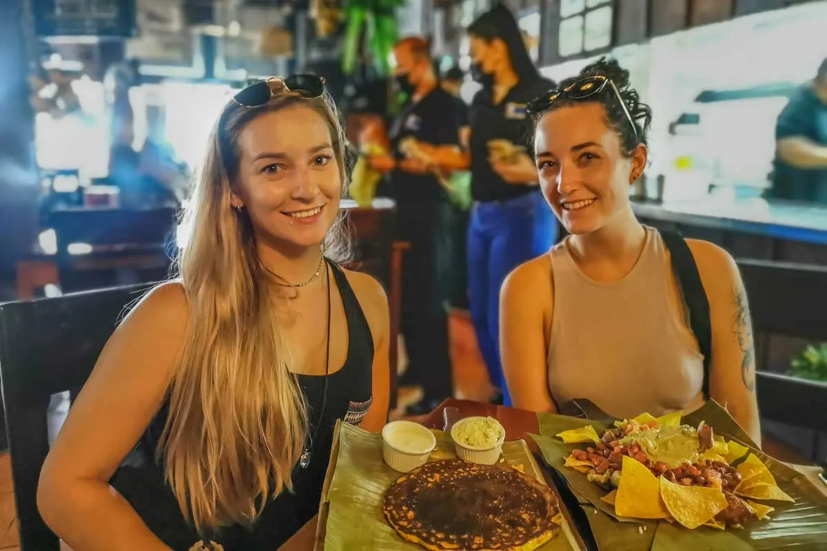 two women eating tradition fod in Costa Rica