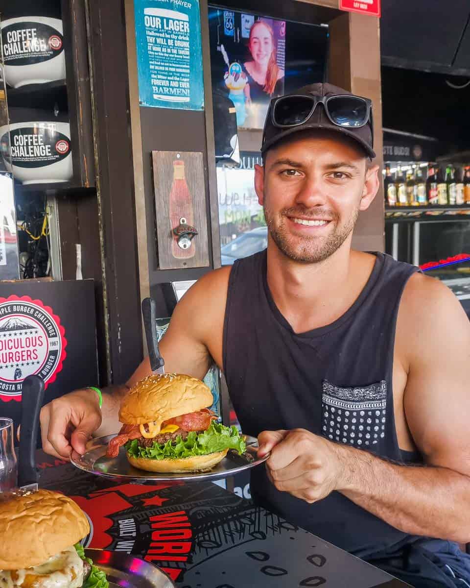 Daniel with a burger at Ridiculous Burgers 