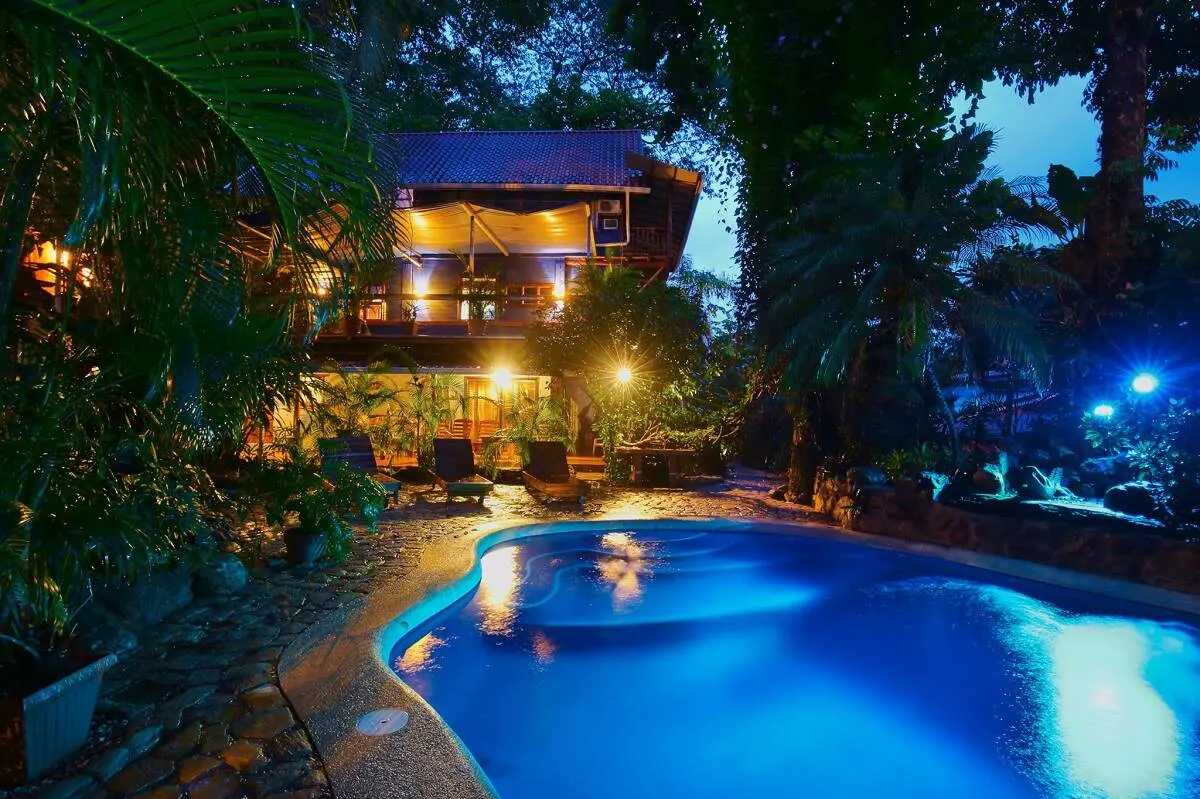 pool and Tico Adventure Lodge at night