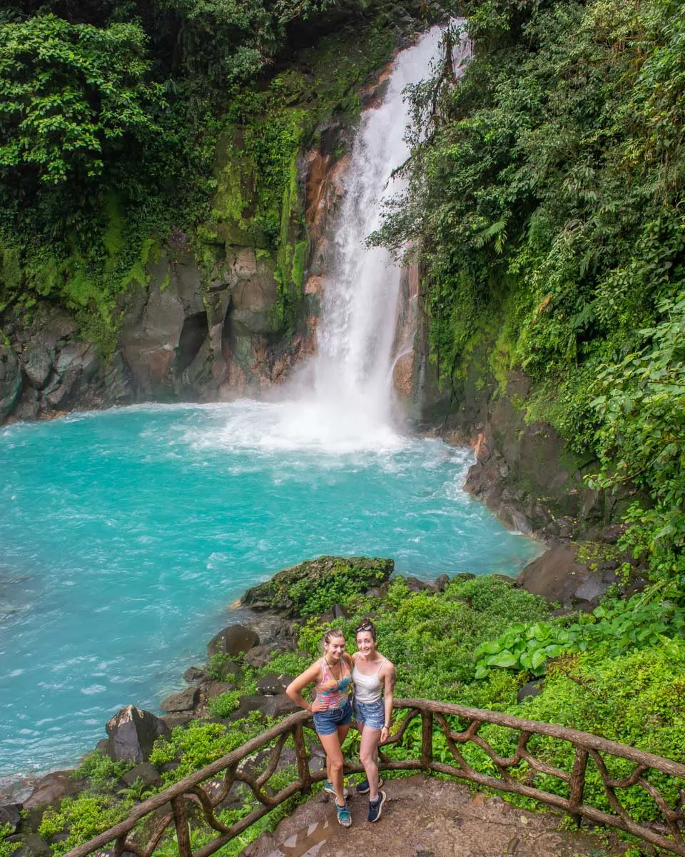 Two people pose for a photo at Rioe Celeste Waterfall