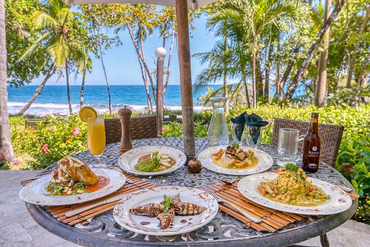 Ylang Ylang Restaurant meals on a table at the beach