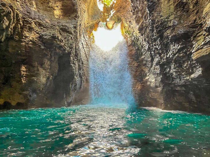 A landscape shot of La Leona Waterfall in Costa Rica