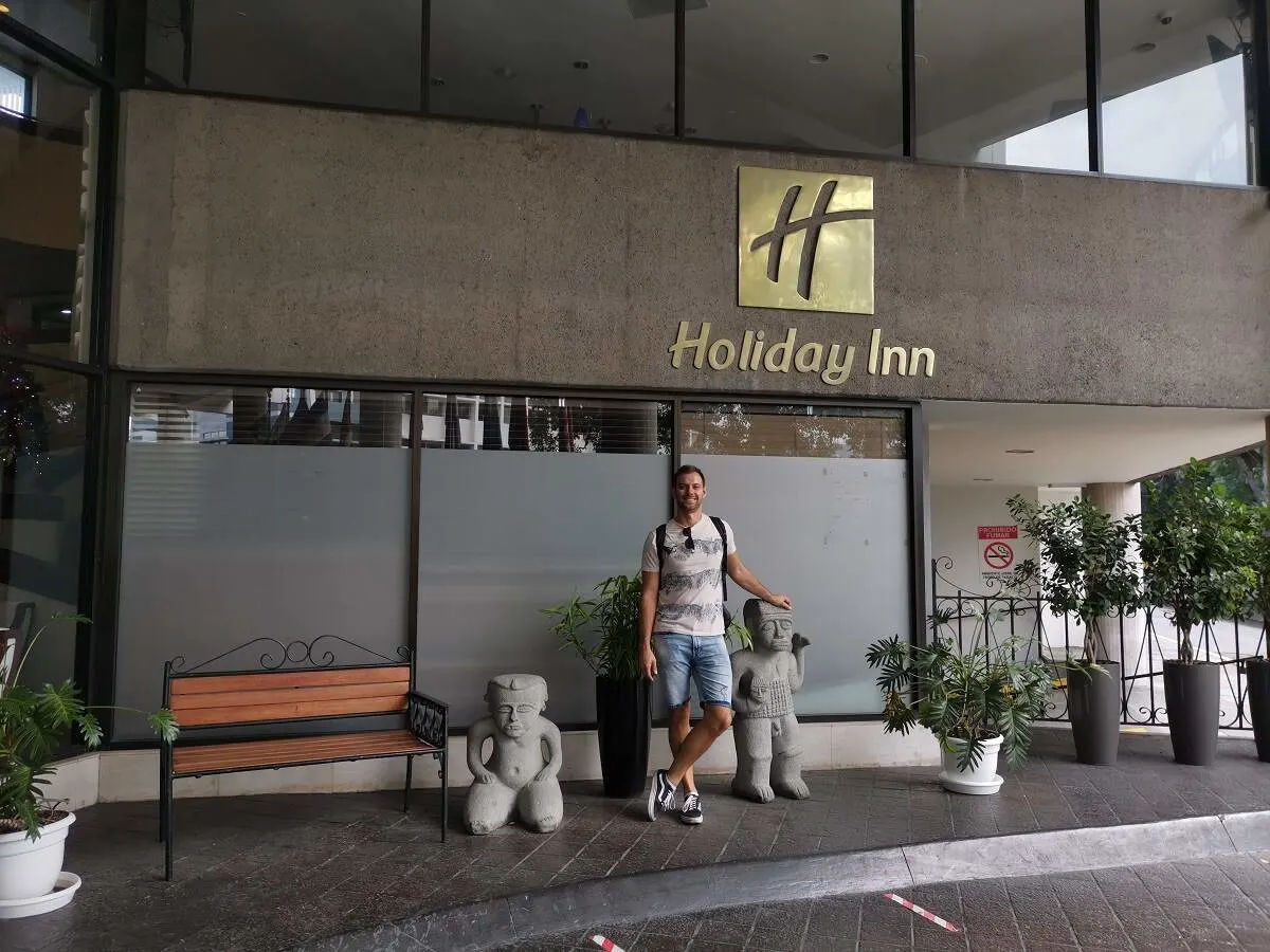 man stands out the front of the Holiday Inn Hotel in San Jose, Costa Rica