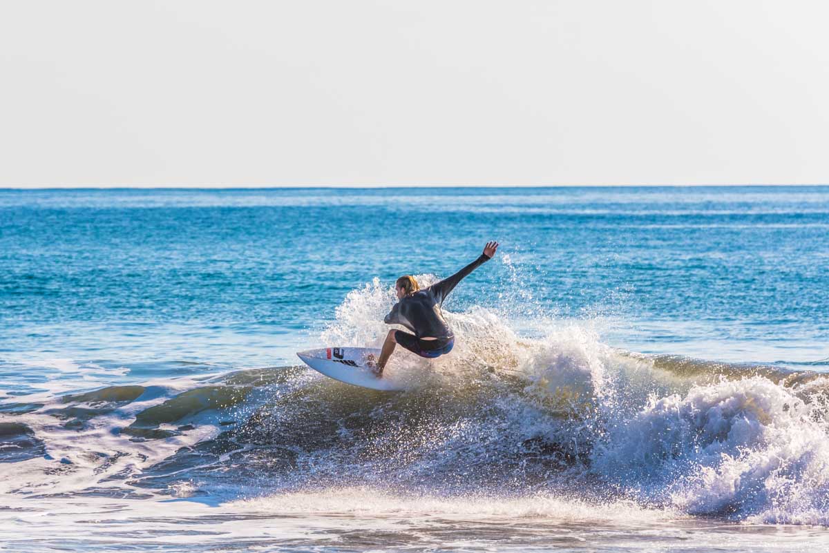 A man surfs at Playa Hermosa, Costa Rica