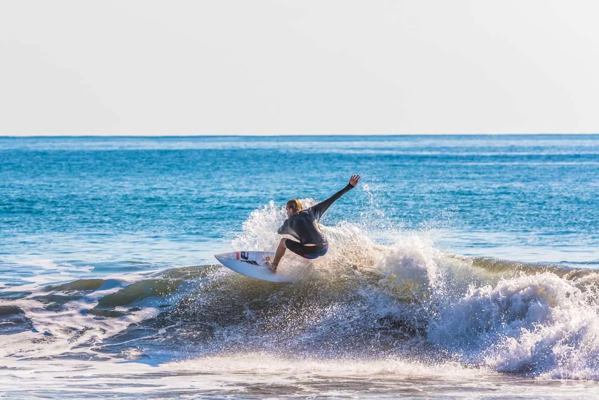 A man surfs at Playa Hermosa, Costa Rica