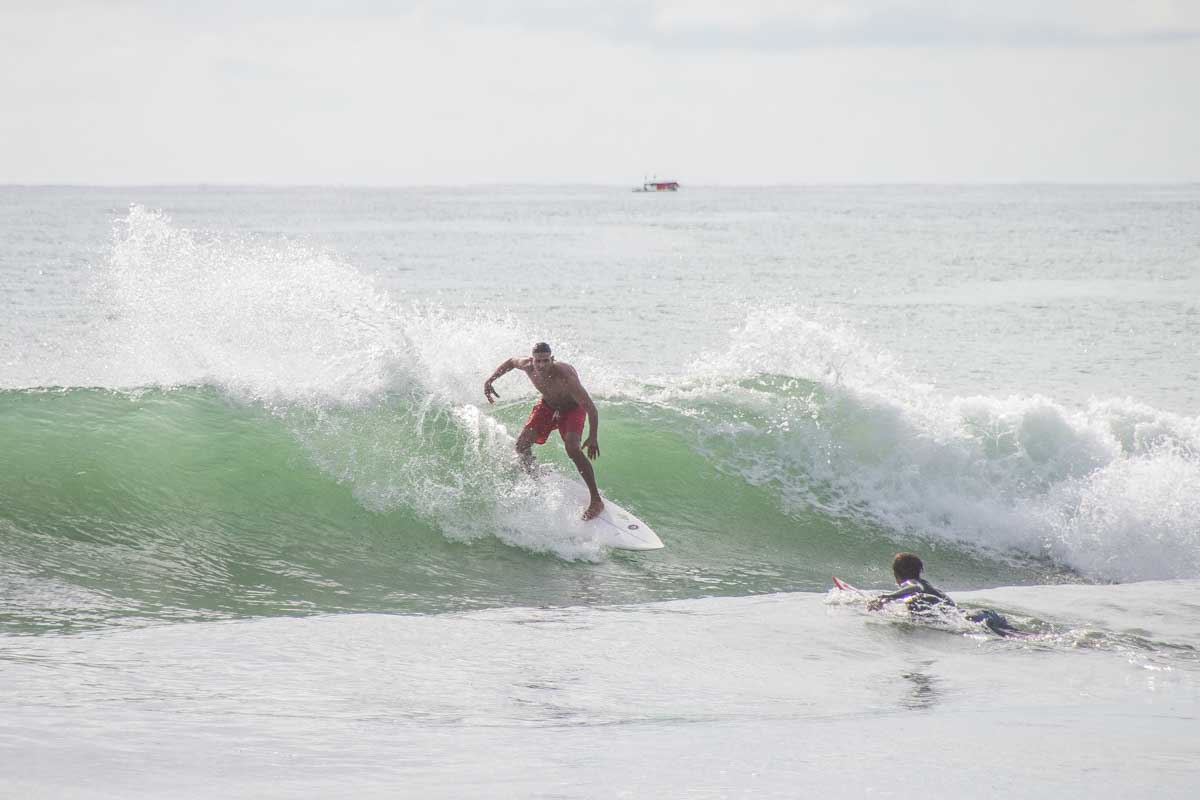 A man surfs at Santa Teresa Beach, Costa Rica