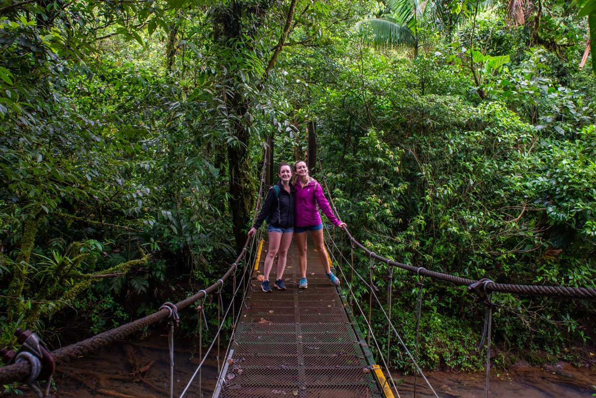 Bailey and her friend on a hanging bridge at Rio Celeste