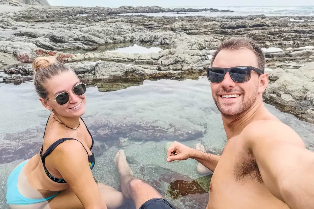 Daniel and Bailey take a selfie in Costa Rica in a pool of water