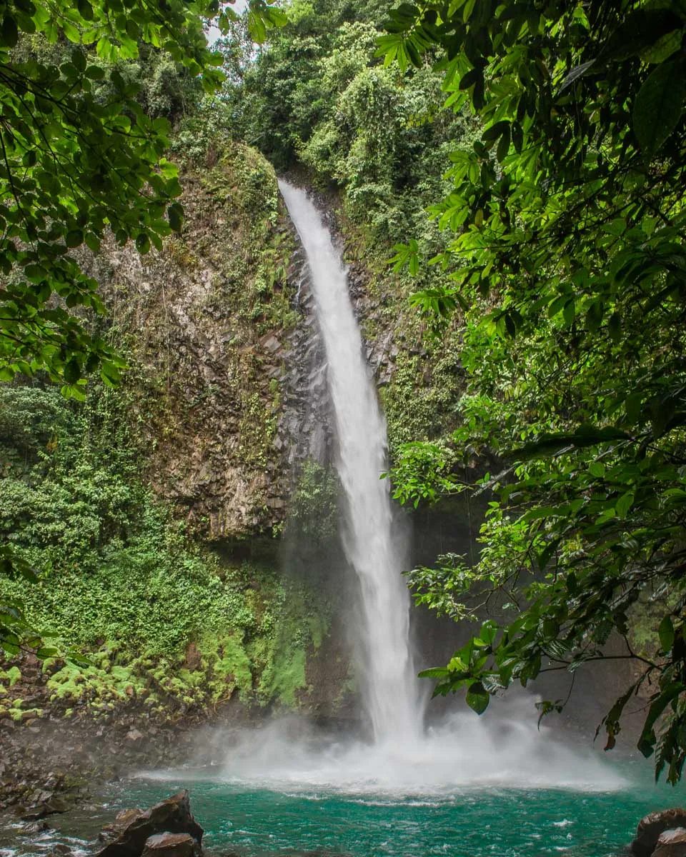 La Fortuna Waterfall surrounded by lush forest