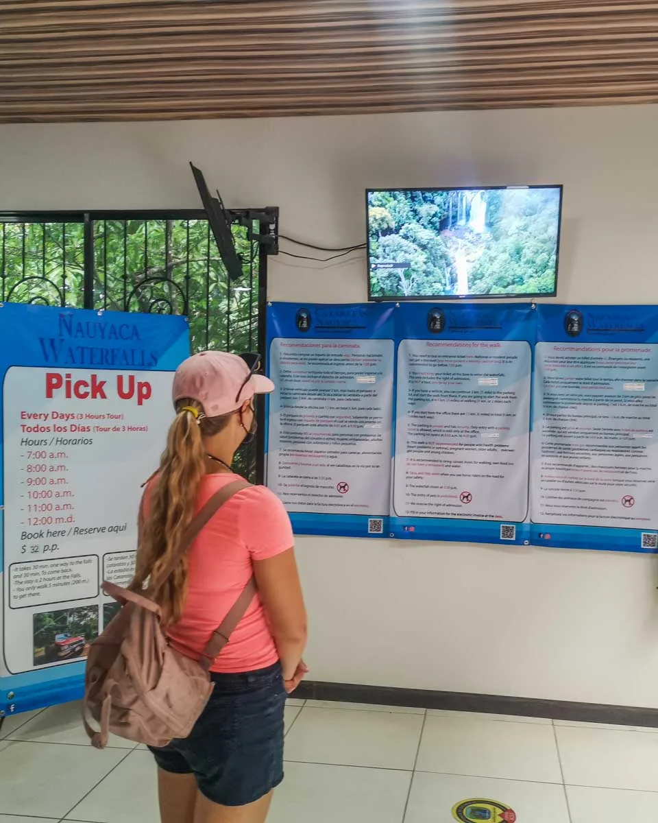 Bailey watches a video at the Nauyaca Waterfalls ticket office