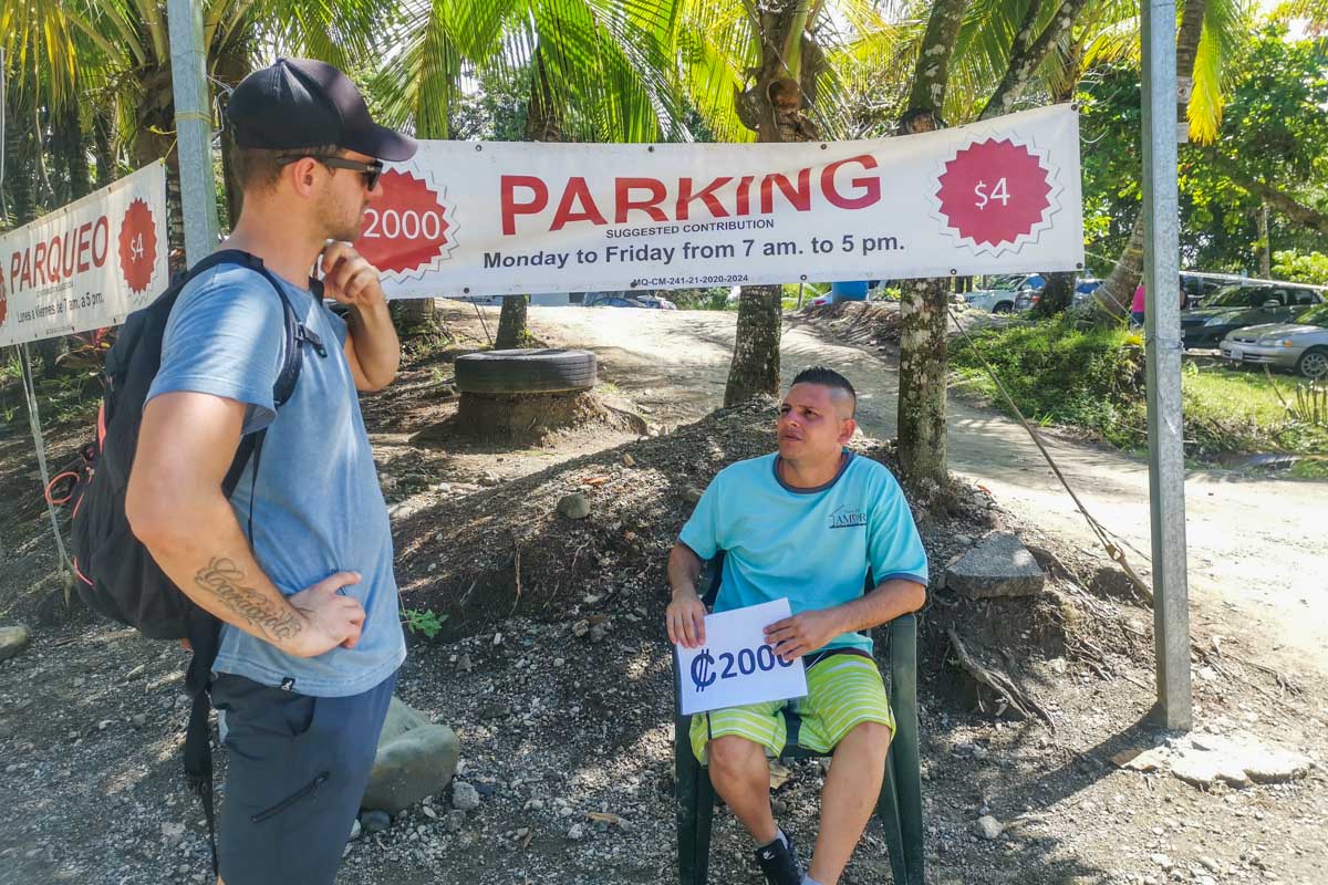 Daniel talks with a parking attendent at Manuel Antonio National Park