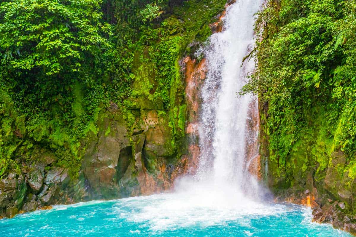 Rio Celeste Waterfall and pond seen in Costa Rica on a beautiful day