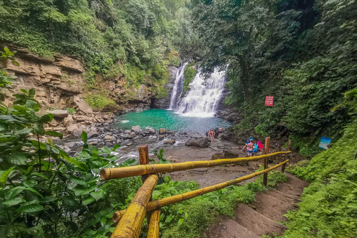 The steps and bamboo rail down to Nauyaca Waterfalls lower falls
