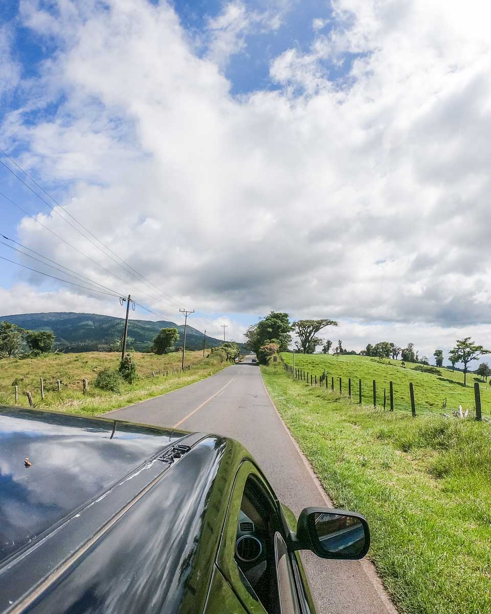 A car drives along the beautiful country road to Poas Volcano, Costa Rica
