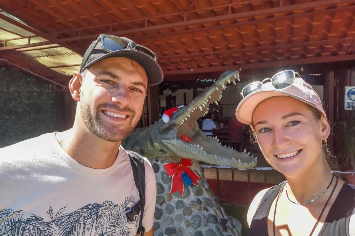 Daniel and Bailey take a photo with the crocodile statue near the Bridge