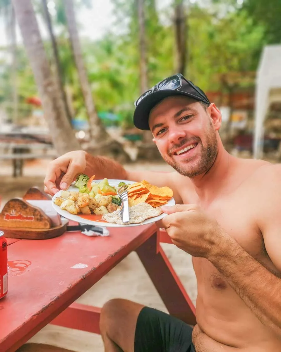 Daniel with his food on Tortuga Island on a tour in Costa Rica