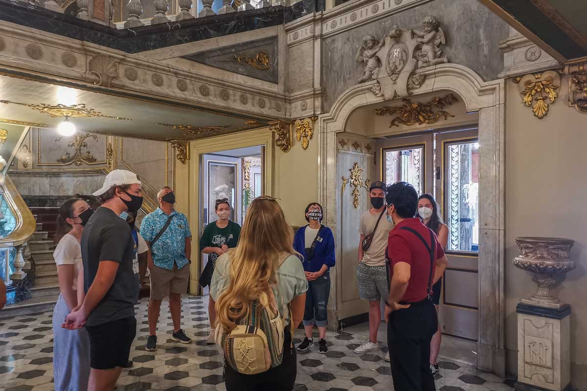 A tour group tours through the National Theater of Costa Rica in San Jose