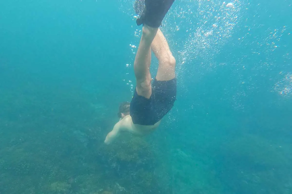 Daniel dives underwater in Costa Rica