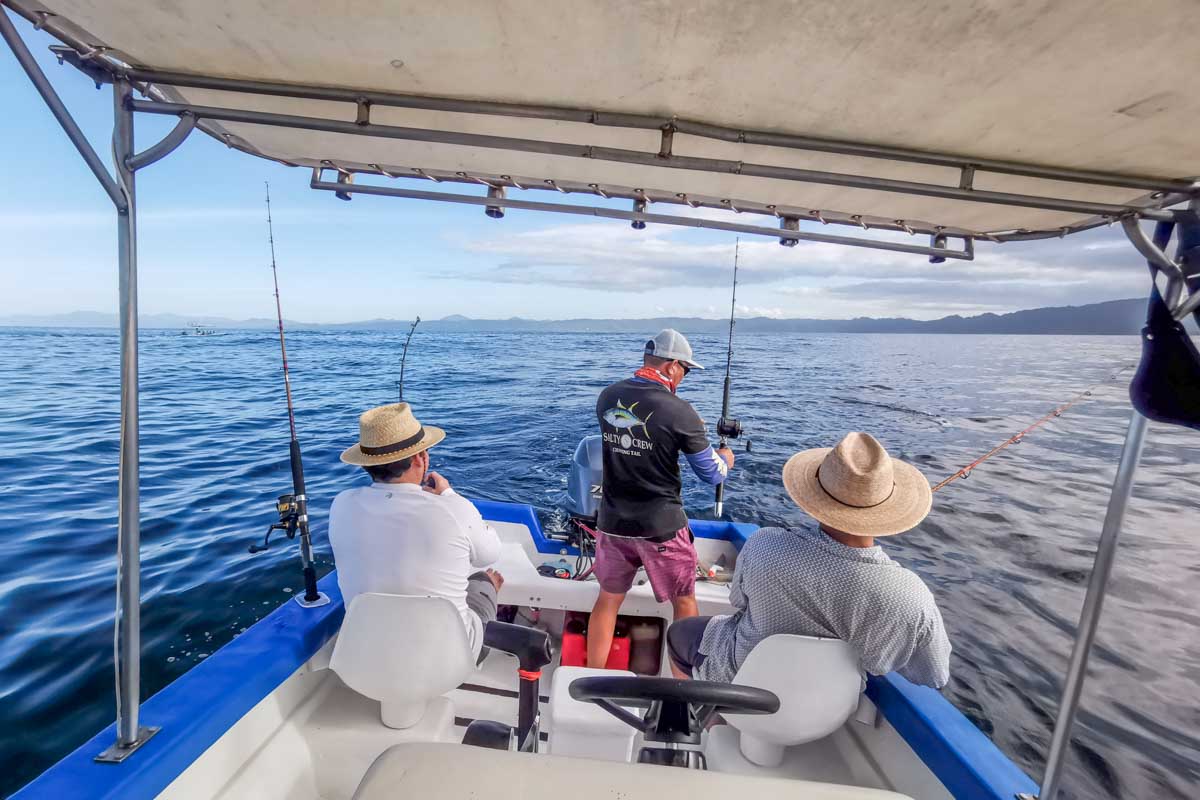 Three people sport fishing on the Osa peninsula, Costa Rica