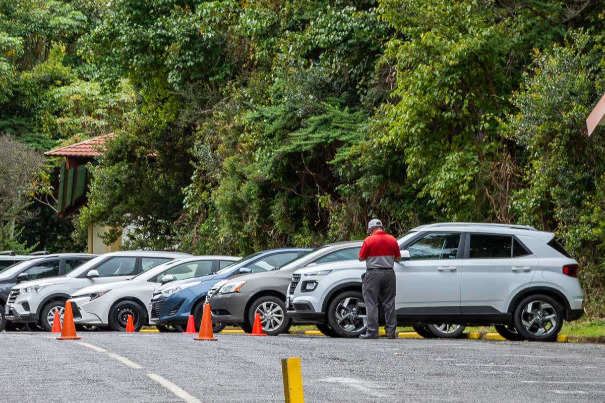 A parking inspector checks vehicles in Costa Rica