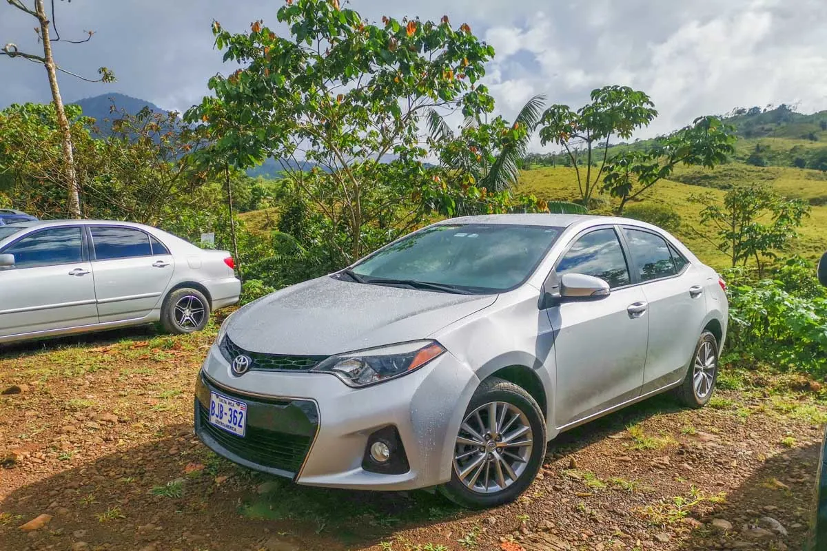 A rental car parked in a parking lot in Costa Rica