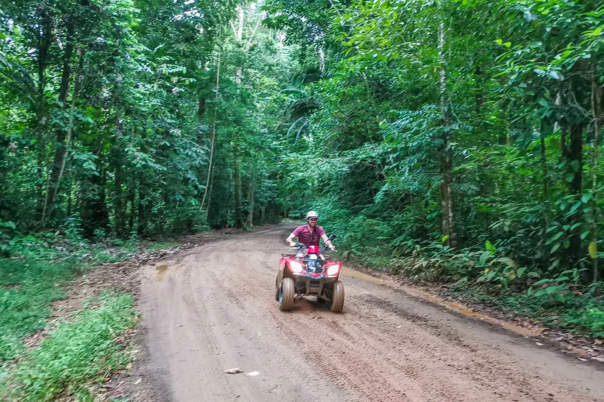 Daniel riding an ATV through the jungle in Costa Rica