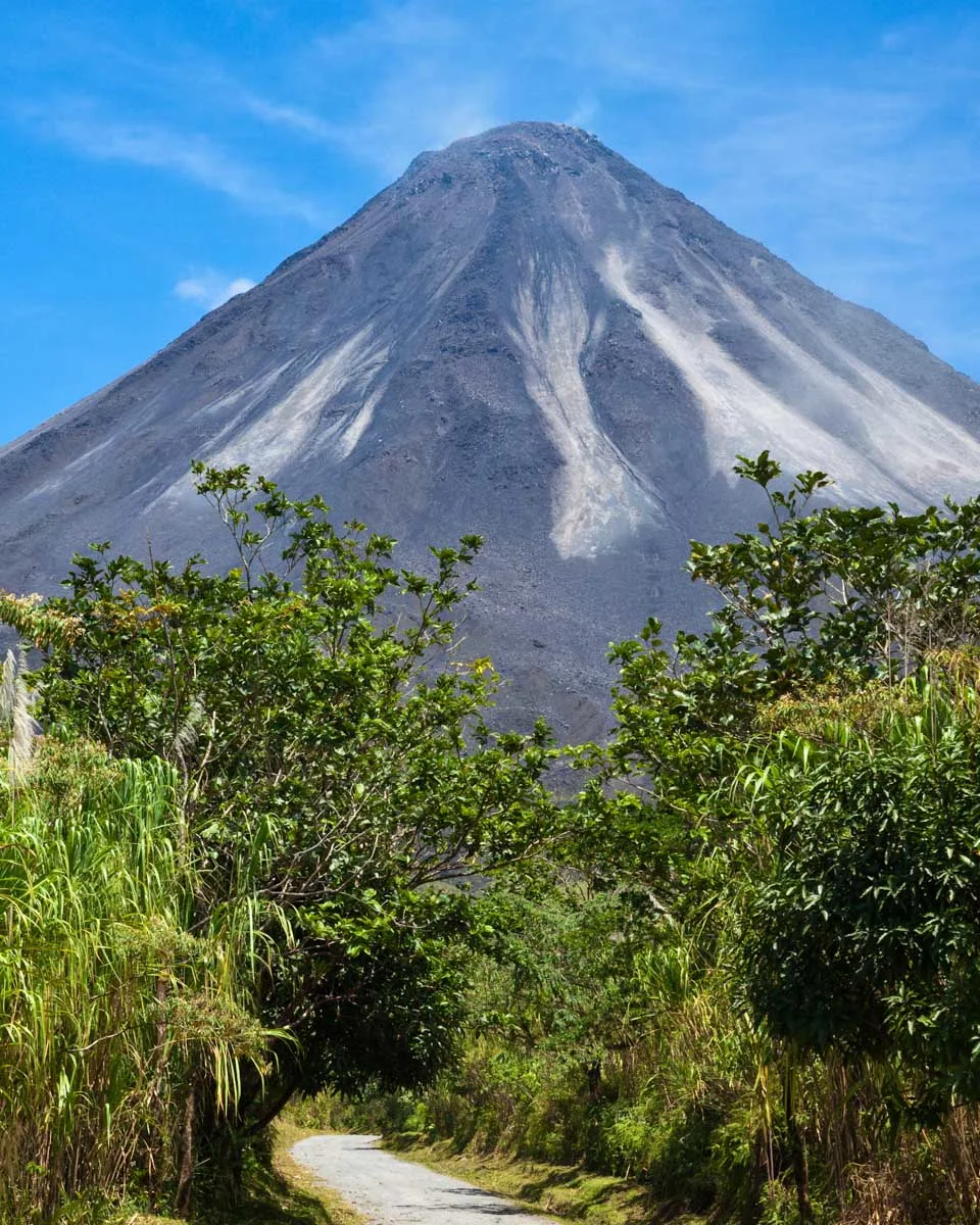 A trail leads towards Arenal Volcano