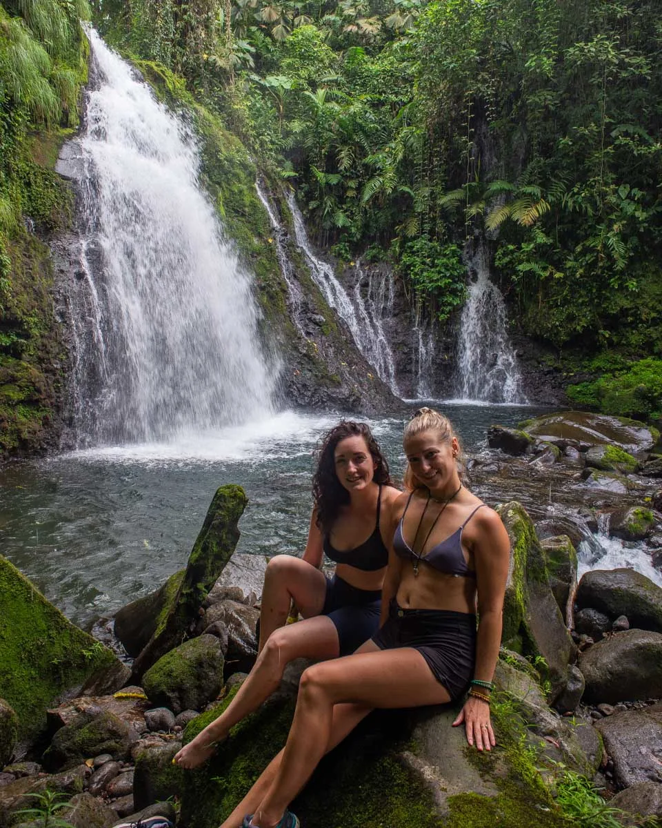 Bailey and her friend at a waterfall at Cascada Pozo Azul
