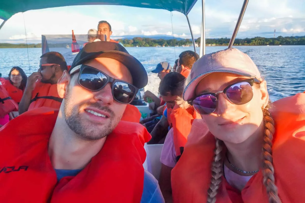 Daniel and Bailey on a whale watching boat with life jackets on in Uvita, Costa Rica