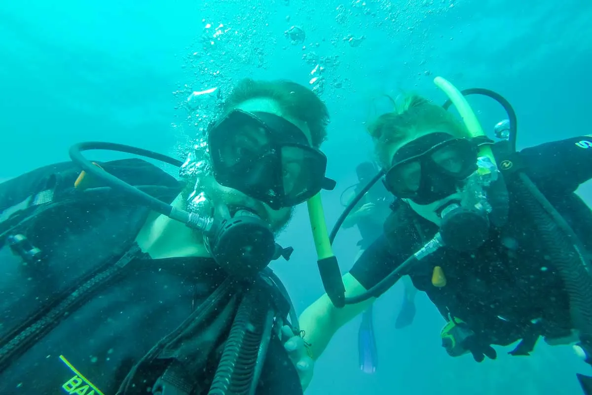 Daniel and Bailey take a selfie while scuba diving in Tamarindo, Costa Rica