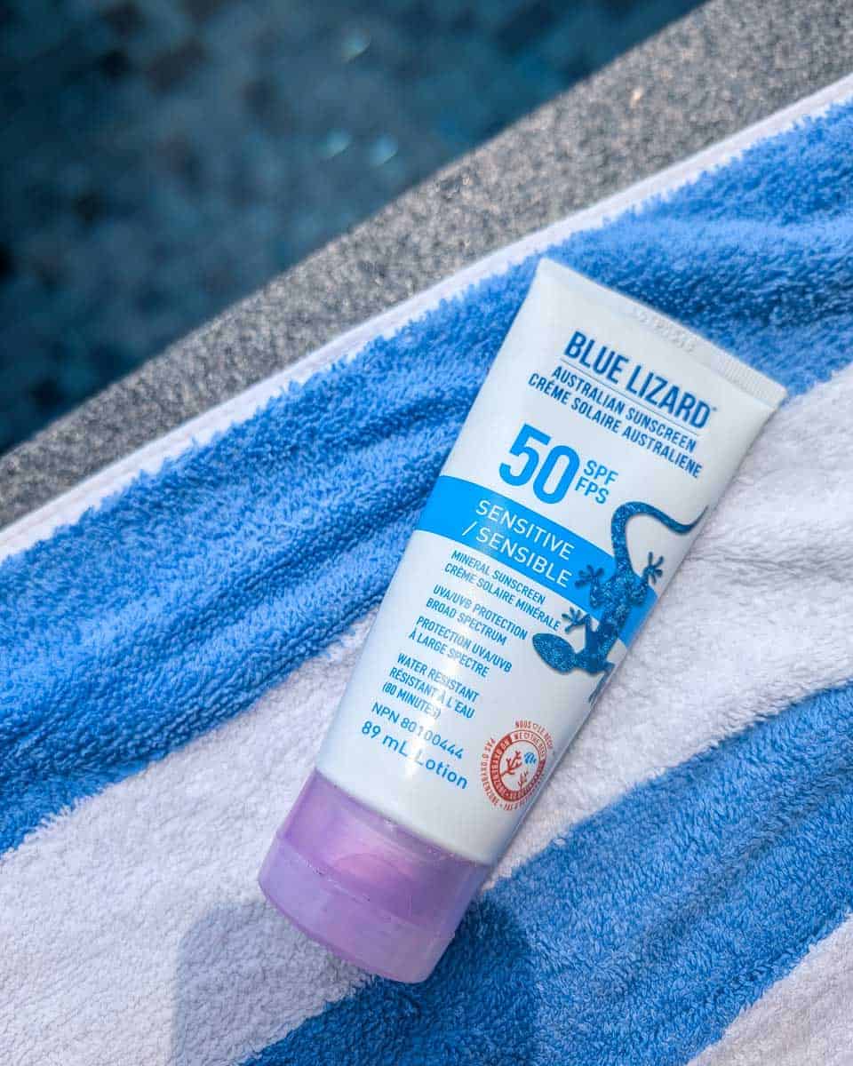 Bailey holds Blue Lizard sunscreen (1)