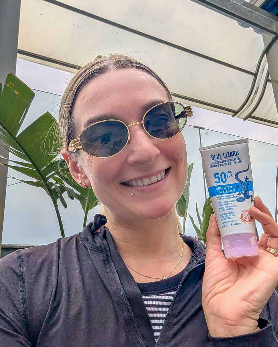 Bailey holds Blue Lizard sunscreen (2)